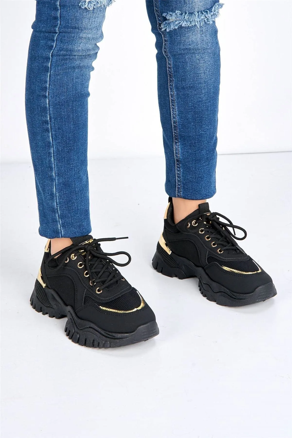 Volos Chunky Sole Gold Trim Trainer in Black