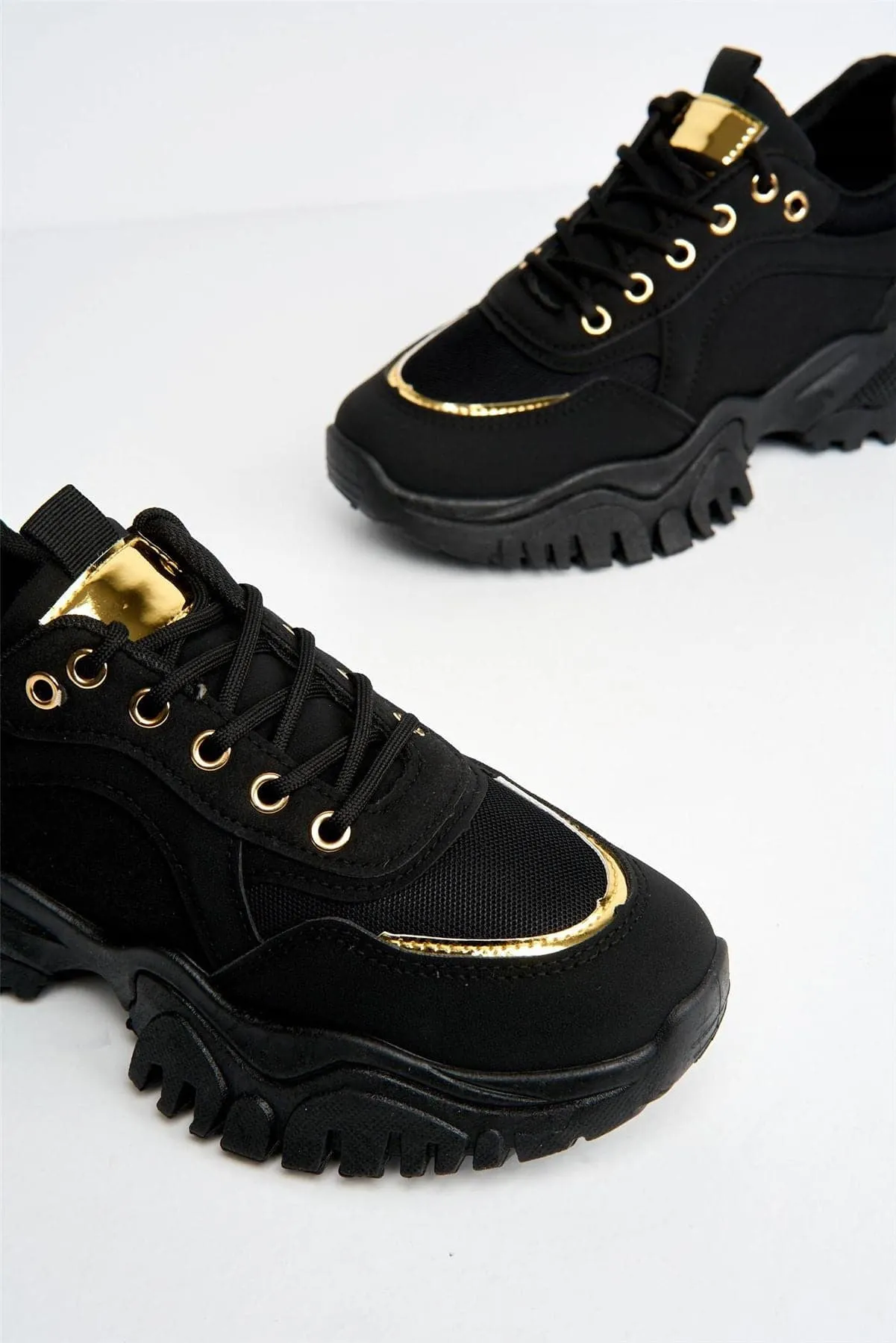 Volos Chunky Sole Gold Trim Trainer in Black